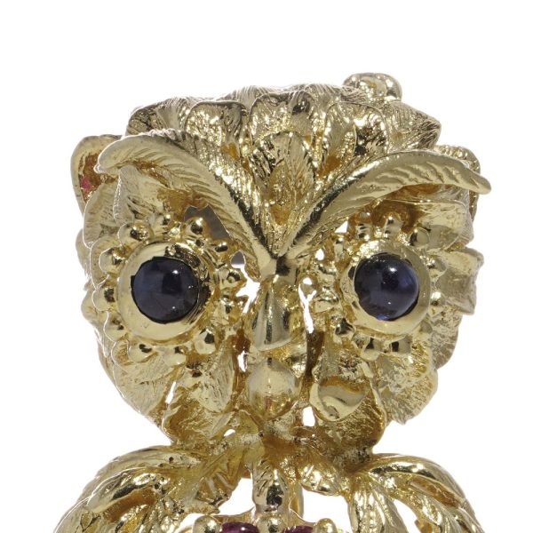 Vintage owl brooch with rubies and sapphires in gold.