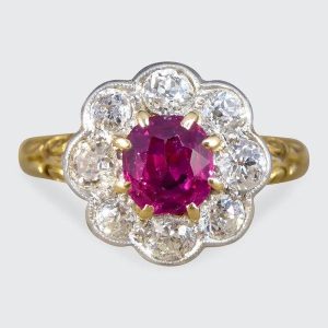 Ruby and diamond cluster ring in yellow and white gold.