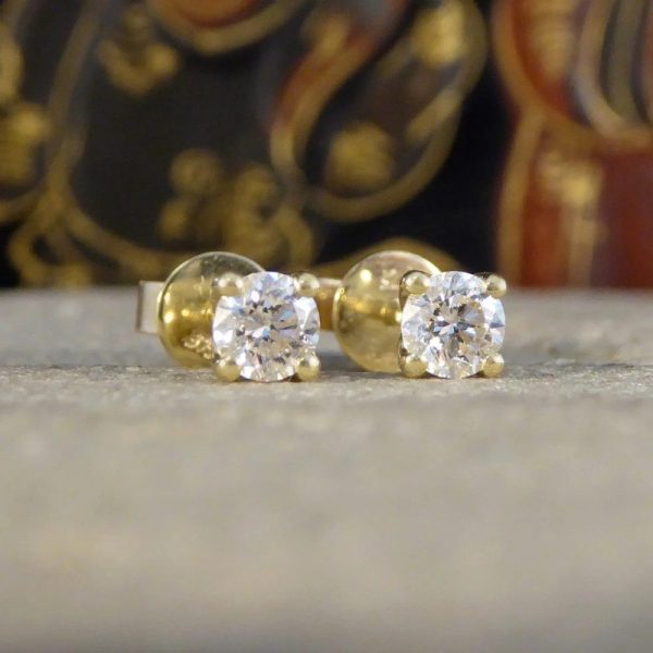 Diamond stud earrings in gold.