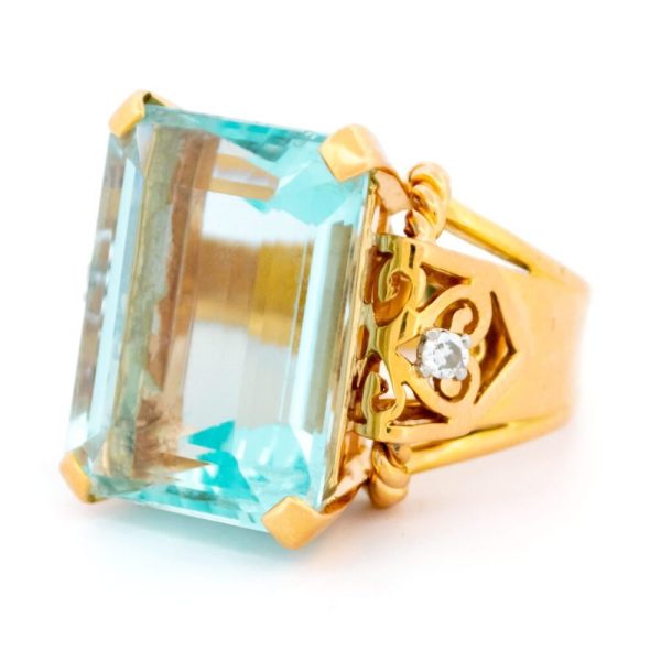 Aquamarine and diamond tank ring in yellow gold.