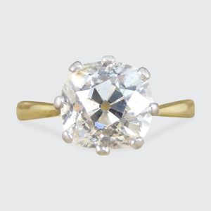 Diamond solitaire ring in yellow and white gold.