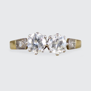 Diamond two stone ring set in white and yellow gold. 