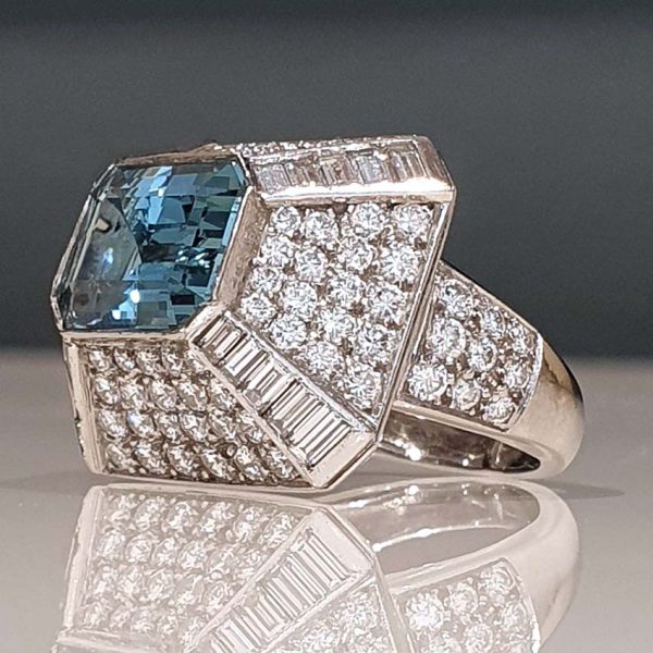 Vintage 4ct Aquamarine and Diamond Bombe Cluster Ring, 4ct good colour emerald-cut aquamarine set atop a handmade geometric platinum mount, Circa 1980s