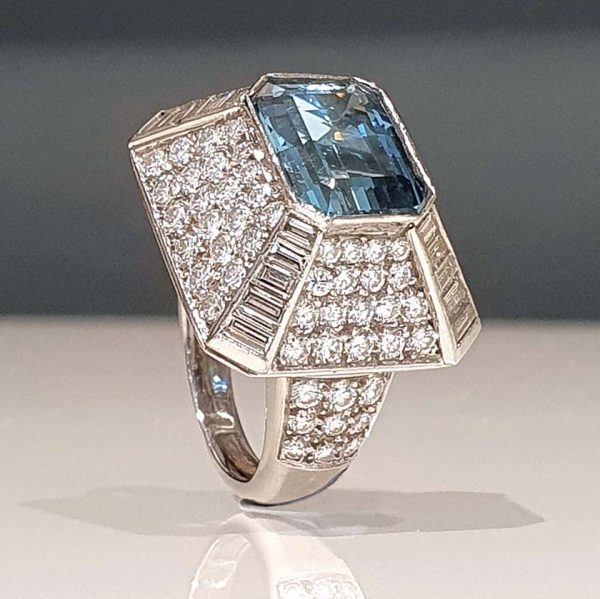 Vintage 4ct Aquamarine and Diamond Bombe Cluster Cocktail Ring, 4ct good colour emerald-cut aquamarine set atop a handmade geometric platinum mount, Circa 1980s