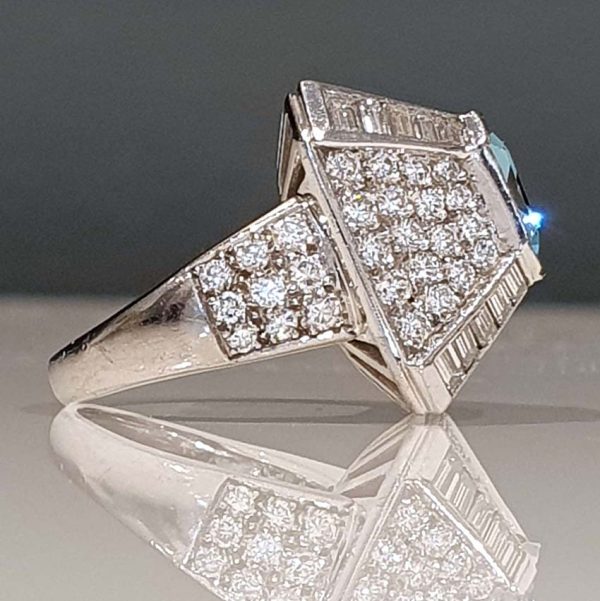 Vintage 4ct Aquamarine and Diamond Bombe Cluster Cocktail Ring, 4ct good colour emerald-cut aquamarine set atop a handmade geometric platinum mount, Circa 1980s