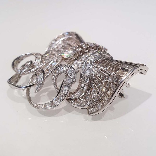 Late Art Deco 9ct Diamond Set Platinum Brooch, set with 9 carats of baguette-cut and brilliant-cut diamonds in handmade platinum setting, late 1930s