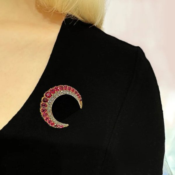 Late Victorian Antique Ruby and Diamond Crescent Moon Brooch in Silver and Gold, outer row of graduating oval and cushion faceted rubies and inner row of old-cut diamonds, Circa 1900