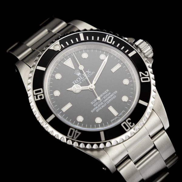 Rolex Submariner 14060M 4 Liner Unpolished NOS Watch with Box and Papers, non date Sub totally unworn, unpolished and retaining original factory case back and bracelet clasp stickers