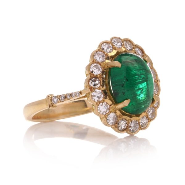 Zambian emerald and diamond cluster ring in gold.