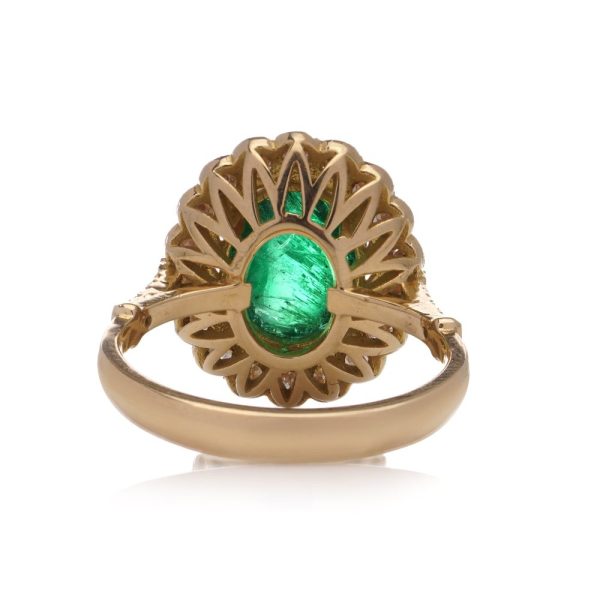 Zambian emerald and diamond cluster ring in gold.