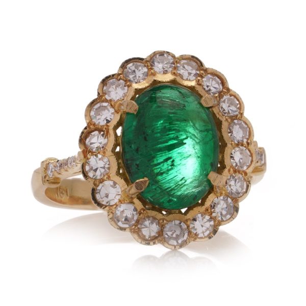Zambian emerald and diamond cluster ring in gold.