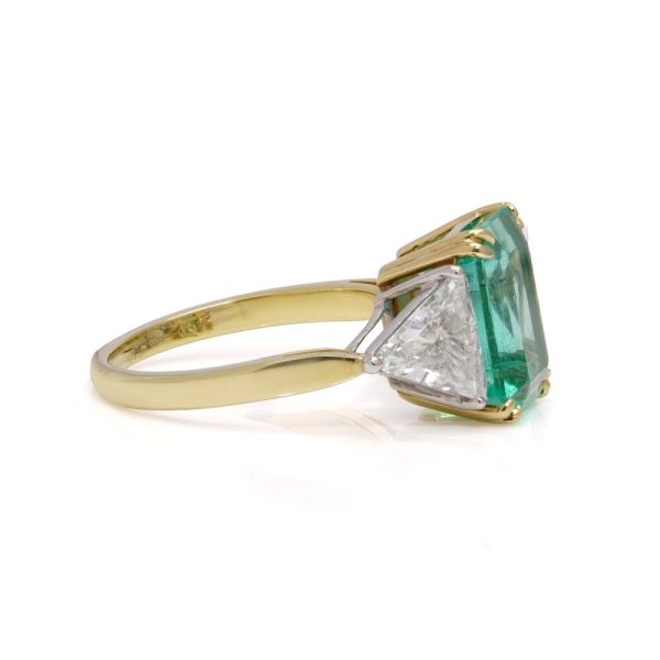 Emerald and diamond ring in gold and platinum.