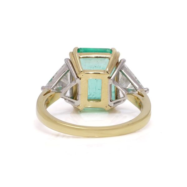 Emerald and diamond ring in gold and platinum.