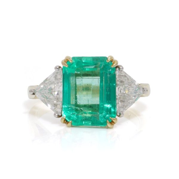 Emerald and diamond ring in gold and platinum.