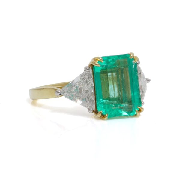 Emerald and diamond ring in gold and platinum.