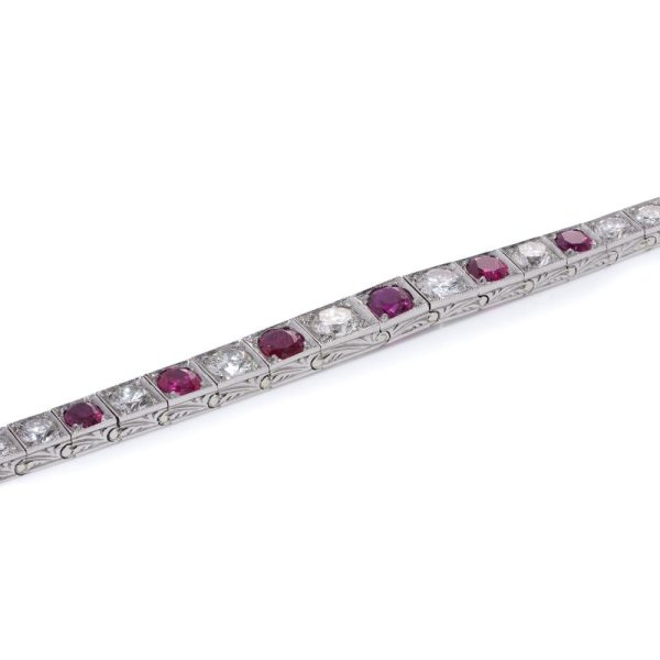 Natural Burma Ruby and Diamond Line Bracelet in Platinum, individual square shaped articulated links set with 4.65cts round brilliant-cut diamonds and 2.22cts oval natural no heat Burma rubies