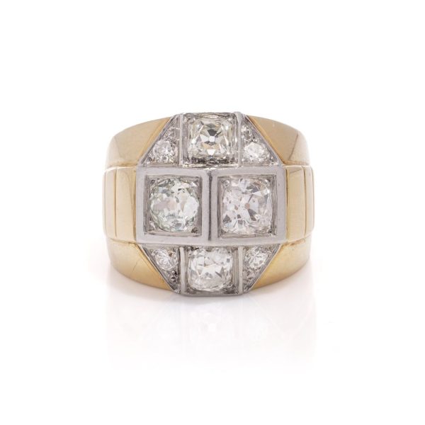 Diamond dome ring in gold and platinum. 