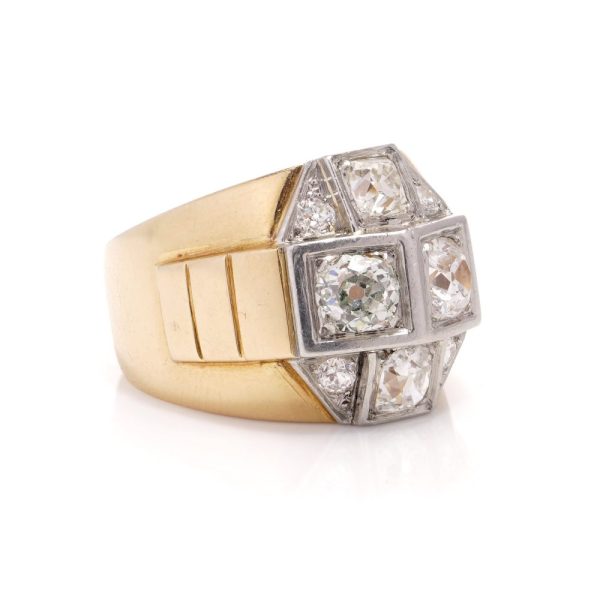 Diamond dome ring in gold and platinum. 