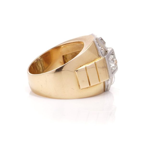 Diamond dome ring in gold and platinum. 