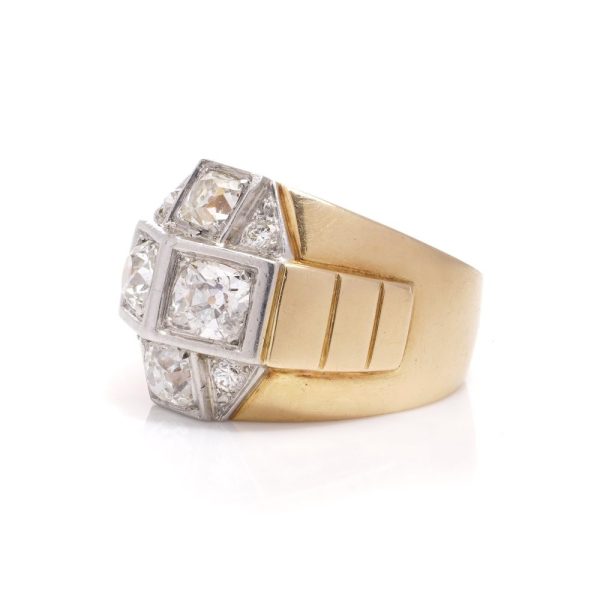 Diamond dome ring in gold and platinum. 