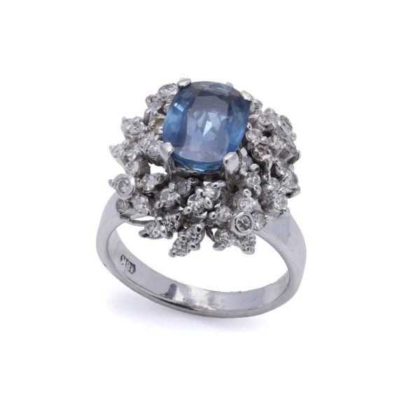 Sapphire and diamond cluster ring in white gold. 