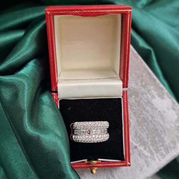 3.50ct Princess and Brilliant Cut Diamond Huggie Ring, central row of square princess-cut diamonds accented by top and bottom gently domed edges studded with sparkling brilliant-cut diamonds in 18ct white gold