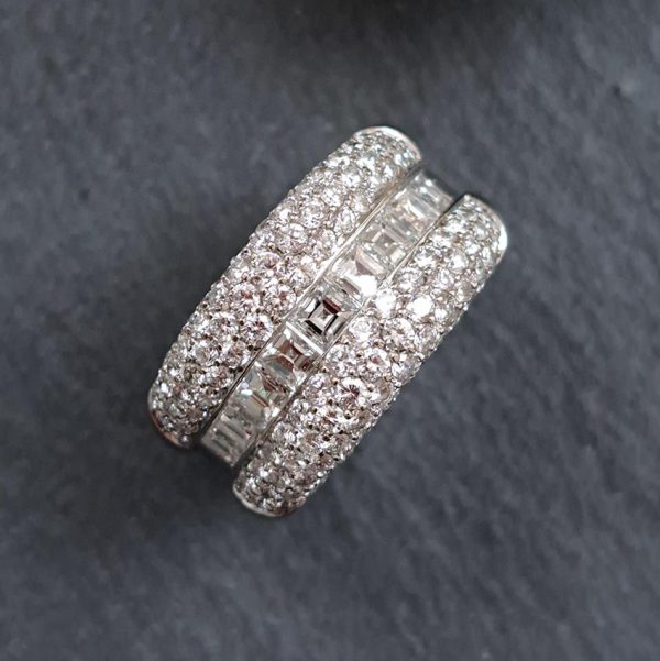 3.50ct Princess and Brilliant Cut Diamond Huggie Ring, central row of square princess-cut diamonds accented by top and bottom gently domed edges studded with sparkling brilliant-cut diamonds in 18ct white gold