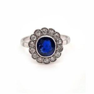 Vintage sapphire and diamond cluster engagement ring in 18ct white gold