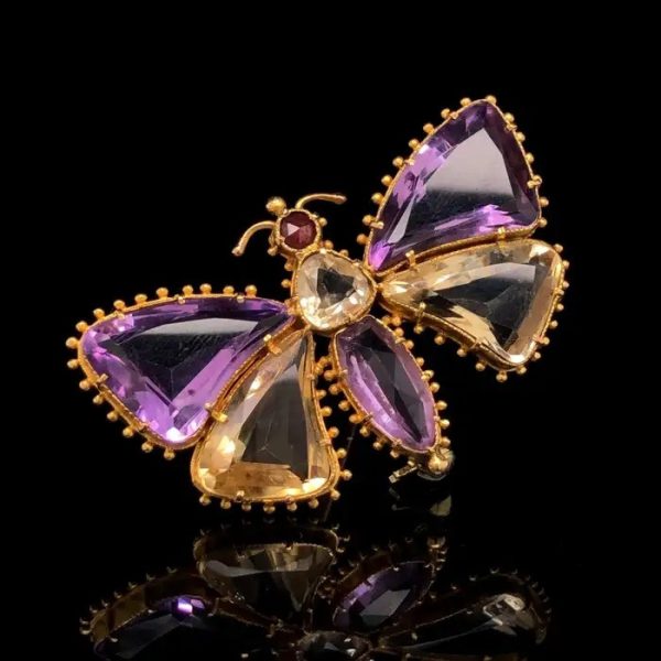 Antique Regency Amethyst and Citrine Butterfly Brooch with rose-cut garnet head in 18ct yellow gold with beaded gold borders. Early 19th century Circa 1810s