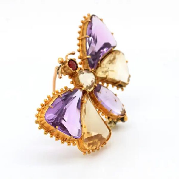 Antique Regency Amethyst and Citrine Butterfly Brooch with rose-cut garnet head in 18ct yellow gold with beaded gold borders. Early 19th century Circa 1810s