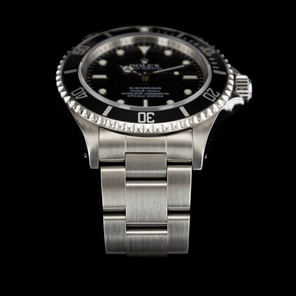 Rolex Submariner 14060M 4 Liner Unpolished NOS Watch with Box and Papers, non date Sub totally unworn, unpolished and retaining original factory case back and bracelet clasp stickers