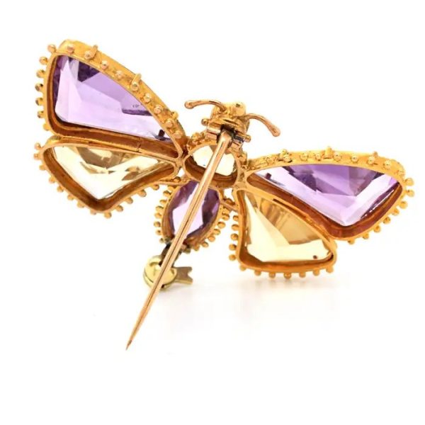 Antique Regency Amethyst and Citrine Butterfly Brooch with rose-cut garnet head in 18ct yellow gold with beaded gold borders. Early 19th century Circa 1810s