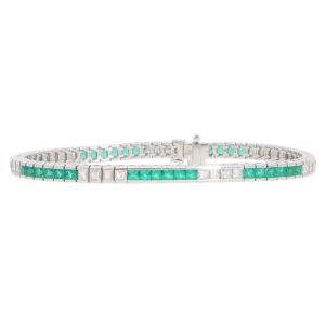 Contemporary 18ct white gold scissor cut emeralds and french cut diamonds line tennis bracelet