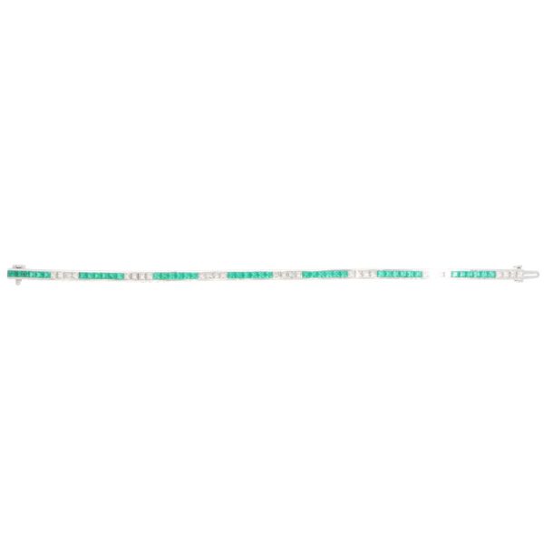 Contemporary 18ct white gold scissor cut emeralds and french cut diamonds line tennis bracelet