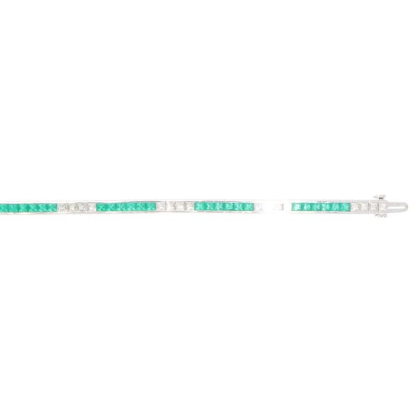 Contemporary 18ct white gold scissor cut emeralds and french cut diamonds line tennis bracelet