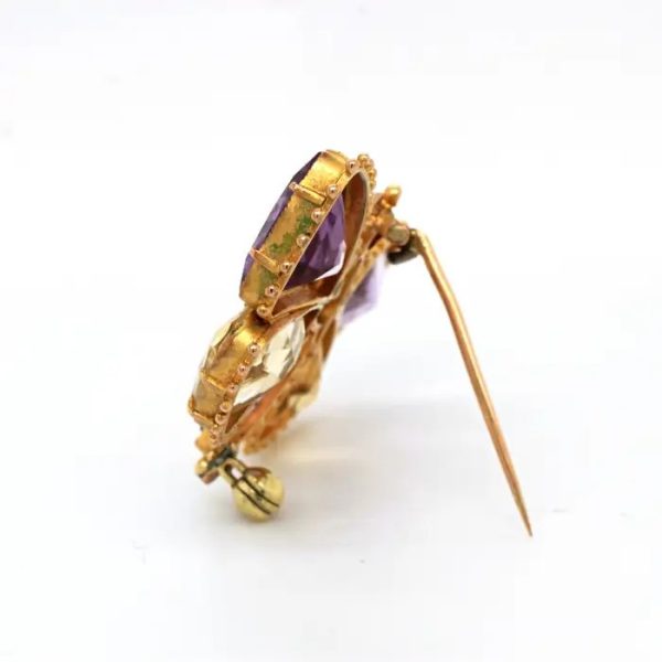 Antique Regency Amethyst and Citrine Butterfly Brooch with rose-cut garnet head in 18ct yellow gold with beaded gold borders. Early 19th century Circa 1810s