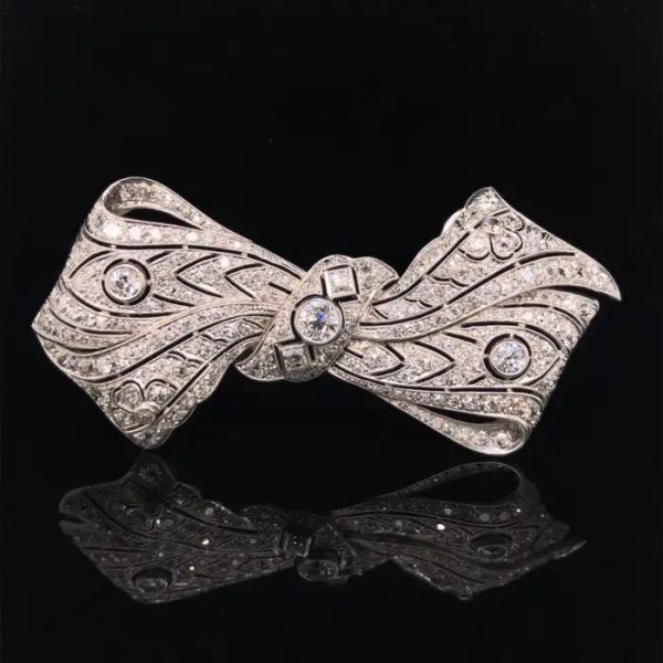 Vintage 8ct Old Cut Diamond Bow Brooch, set with 8 carats of old-cut, single-cut and square shaped diamonds in 18ct white gold with a 14ct white gold pin