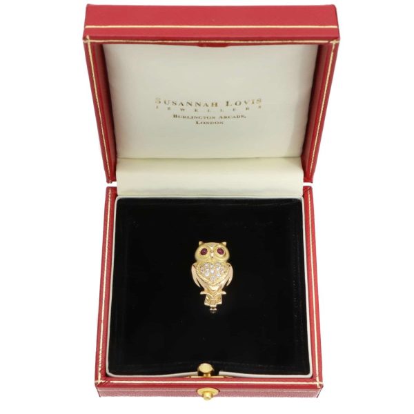 A vintage diamond and ruby owl brooch made in 18ct yellow gold