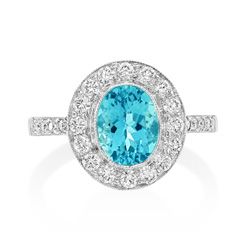 1.17ct Aquamarine and Diamond Cluster Engagement Ring, 1.17ct oval-cut aquamarine within halo border of sparkling round brilliant-cut diamonds in 18ct white gold with diamond-set shoulders