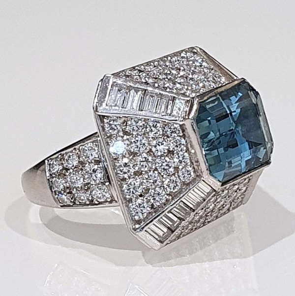 Vintage 4ct Aquamarine and Diamond Bombe Cluster Ring, 4ct good colour emerald-cut aquamarine set atop a handmade geometric platinum mount, Circa 1980s