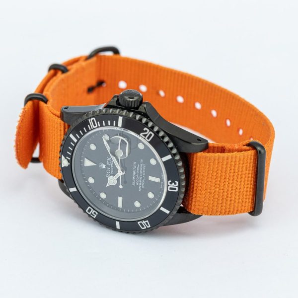 Rolex Submariner Stealth 16610 Black DLC Dial and Orange Strap, 40mm case has been customised with a black diamond like coating and fitted to orange NATO strap