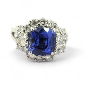 Oval Cushion Shaped Sapphire and Diamond Cluster Engagement Ring in 18ct white gold with split shoulders