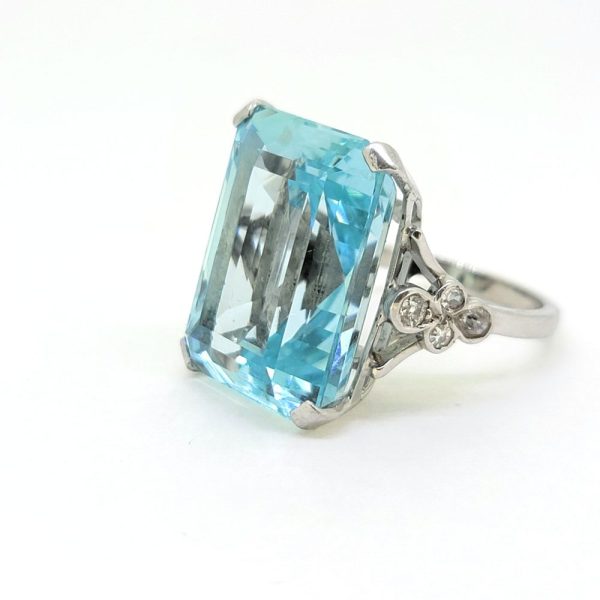 30ct Emerald Cut Aquamarine Cocktail Ring with Diamonds, large 30ct emerald-shaped step-cut aquamarine accented with sparkling diamonds to the shoulders in 18ct white gold