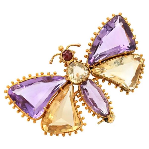 Antique Regency Amethyst and Citrine Butterfly Brooch with rose-cut garnet head in 18ct yellow gold with beaded gold borders. Early 19th century Circa 1810s