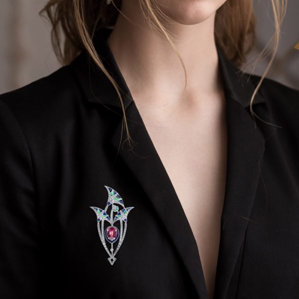 3.35ct Pink Tourmaline Sapphire Emerald and Diamond Brooch depicting a central pink lotus flower bud under its leaves in 18ct white gold