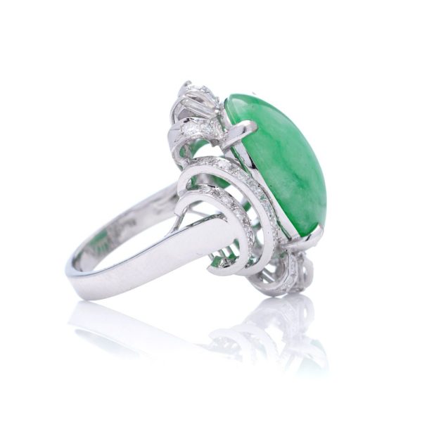 Vintage 23ct Natural Jadeite Jade and Diamond Cluster Ring, cabochon certified natural jade surrounded brilliant and baguette-cut diamonds in 14ct white gold. Circa 1970s