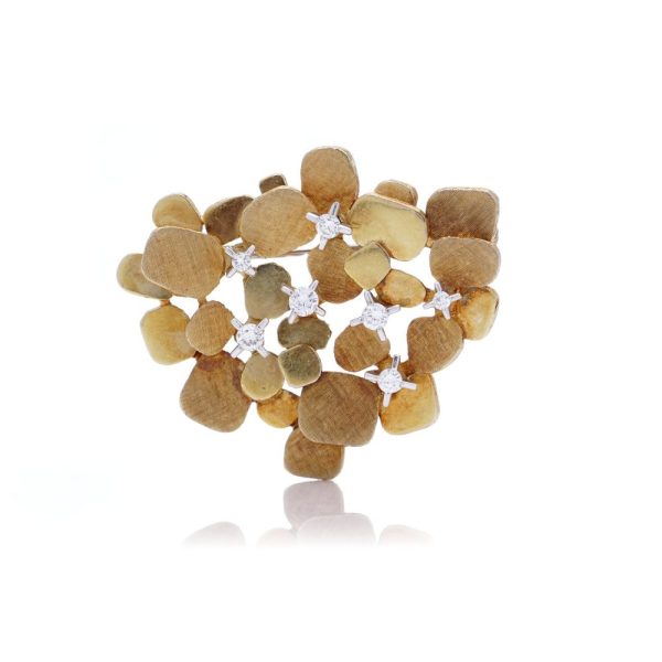 Vintage gold textured petal design diamond brooch.