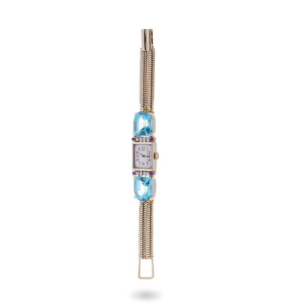 Ladies gold cocktail watch with Gemstones.