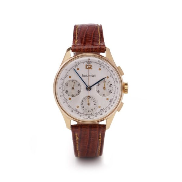 Vintage Eberhard 18ct Gold Mechanical Chronograph Watch, 35mm round gold case with white dial with three sub-dials and tachymeter scale, on brown leather strap. Circa 1950s