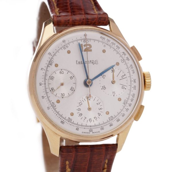 Vintage Eberhard 18ct Gold Mechanical Chronograph Watch, 35mm round gold case with white dial with three sub-dials and tachymeter scale, on brown leather strap. Circa 1950s